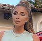 Larsa Pippen sunbathes topless in a black thong and wears lacy。